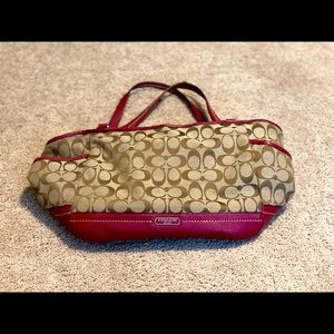 Coach purse with red detailing.